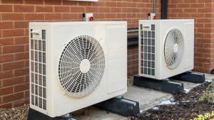 Two air source heat pumps on a wall