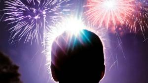 figure watching fireworks
