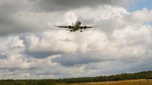 plane flying over a field